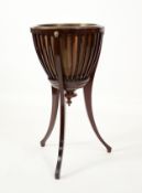 JARDINIERE: Early 20th century mahogany basket planter or brass lined jardiniere stand with lion