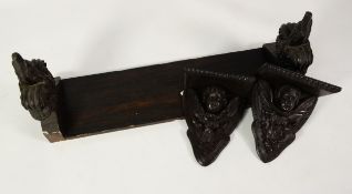 PAIR OF LATE NINETEENTH/ EARLY TWENTIETH CENTURY DARK STAINED AND CARVED OAK WALL BRACKETS, each