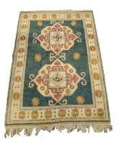 HEAVY QUALITY HAND-WOVEN WOOL RUG with embossed pattern of two large medallions with ram's horn