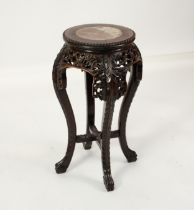 CHINESE VASE STAND: 19th century Chinese hardwood vase stand of small proportions and carved in