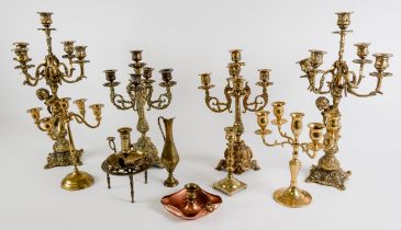 TWO PAIRS OF BRASS CANDELABRAS, one pair five light and cast with cherubs, 18” (45.7cm) high,