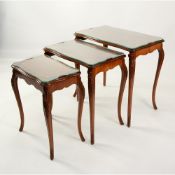 EPSTEIN BROS, NEST OF THREE FIGURED WALUNUT AND INLAID OCCASIONAL TABLES