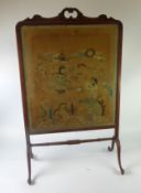 ANTIQUE WALNUT FRAMED GRATESCREEN, with rococo foliate scroll carved top on cheval feet, joined by a