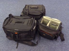 THREE LARGE PROFESSIONAL BLACK CANVAS CAMERA BAGS, with shoulder straps