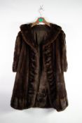 FINE DARK BROWN FULL-LENGTH FUR COAT, with shawl collar, double-breasted, hook fastening front, slit