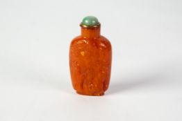 CHINESE SNUFF BOTTLE: twentieth century Qing or later Chinese amber snuff bottle of slender
