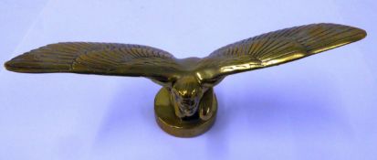 EARLY 20TH CENTURY CAST BRASS CAR MASCOT IN THE FORM OF A KNEELING, NUDE WINGED MAN. Marked Ch (