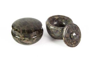 CORNISH SERPENTINE: Grey and dark veined lidded pot, and another in darker hues with red veins, 3 ½”