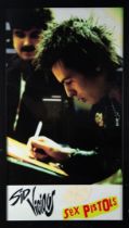 SID VICIOUS- SEX PISTOLS COLOUR POSTER, FRAMED WITH A SIGNATURE ON TORN PAPER SIGNED ‘SID