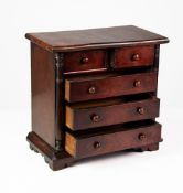 VICTORIAN FIGURED MAHOGANY ‘APPRENTICE PIECE’ CHEST OF DRAWERS, the flame cut oblong top above two