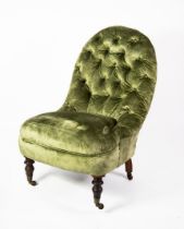 VICTORIAN SPOON-BACKED ARMLESS EASY CHAIR, button upholstered in green velvet, on turned tapering
