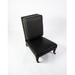 HOWARD & SONS VICTORIAN 'SLIPPER' LOW-SEATED ARMLESS EASY CHAIR, the rectangular high back having