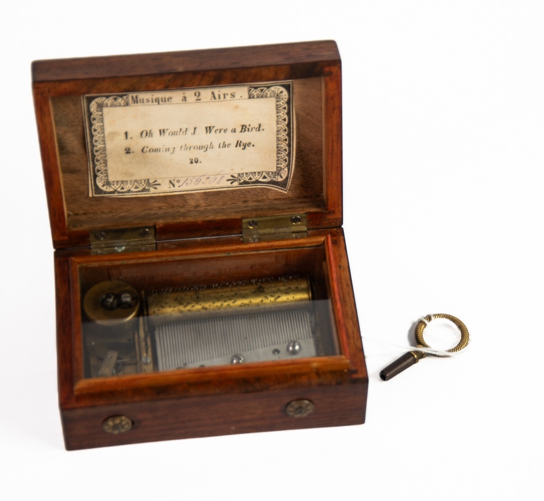 SMALL, EARLY 20th CENTURY ROSEWOOD AND BRASS MOUNTED CYLINDER MUSICAL BOX, playing two airs on a 2