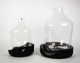 GRADUATED PAIR OF LEONARDO GLASS VASES ON CARVED BLACK WOOD BASES, 17 ½” and 13” (44.4cm and 33cm)