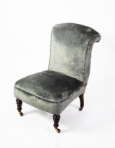 VICTORIAN LOW SEATED ARMLESS EASY CHAIR, the upholstered back with scrolled-over top and the seat