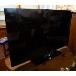 A PANASONIC LED 50" FLAT SCREEN TV WITH REMOTE (TX-50JX87OB)