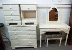 A MODERN CREAM FINISHED CHEST OF TWO SHORT OVER THREE LONG DRAWERS, A TWO DRAWER DRESSING TABLE, A