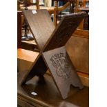 AN OAK CARVED 'X' FRAMED BIBLE/BOOK STAND