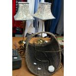 A SMALL WICKER LOG BASKET AND TWO BRASS EFFECT BEDROOM TABLE LAMPS (3)