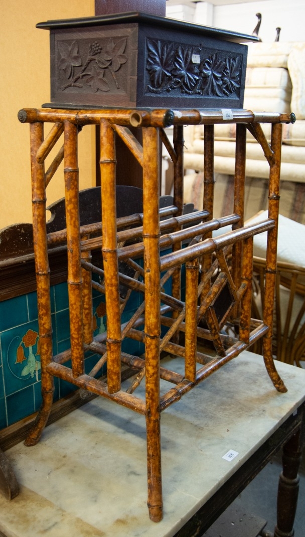 A VICTORIAN OAK CARVED BOX AND A BAMBOO CANTERBURY TABLE (2)