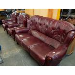 A THREE PIECE LOUNGE SUITE, WOODEN FRAMED AND OX-BLOOD LEATHER ON CABRIOLE FRONT FEET