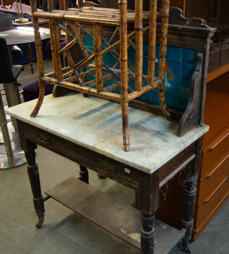 A VICTORIAN MARBLE TOPPED WASHSTAND, HAVING DECORATIVE TILED BACK, (WORMED) (A.F.)