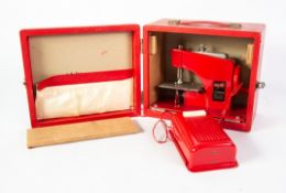 FRANKONIA: tin-plate electric sewing machine, made in Japan and in original box, slight damage to