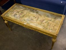 A GILTWOOD OBLONG COFFEE TABLE, THE TOP INSET WITH A MACHINE WOVEN PICTORIAL TAPESTRY, JAPANESE