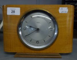 A SMITH'S LIGHT-WOOD MANTEL CLOCK