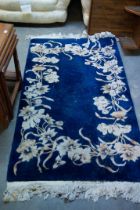 A BLUE GROUND CHINESE CARPET (175cm x 90cm)