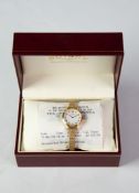 ROTARY LADY'S GILT CASED WRISTWATCH, battery powered with textured finish expanding bracelet, in