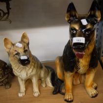 A LARGE POTTERY ALSATIAN DOG AND A SIMILAR SMALLER DOG (2)