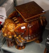 A STREAKED BROWN GLAZED ELEPHANT SEAT (MINOR CHIPS) 19" (48cm) high