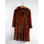 RED / BROWN DYED SQUIRREL FULL LENGTH FUR COAT with revere collar, four button front with loop