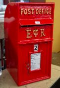 A REPRODUCTION BRITISH POST BOX, IN RED WITH GOLD COLOURED WRITING