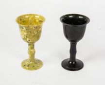 ORIENTAL JADE: Two south-east Asian stem cups, one in black, the other mottled green, 3½" (9 cm)