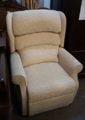 A MODERN ELECTRIC RECLINING ARMCHAIR, IN CREAM FABRIC (SLIGHT BURN TO TOP)