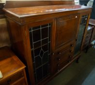 AN EARLY TWENTIETH CENTURY MAHOGANY SIDE BY SIDE BUREAU BOOKCASE, THE CENTRAL SECTION HAVING DROP-