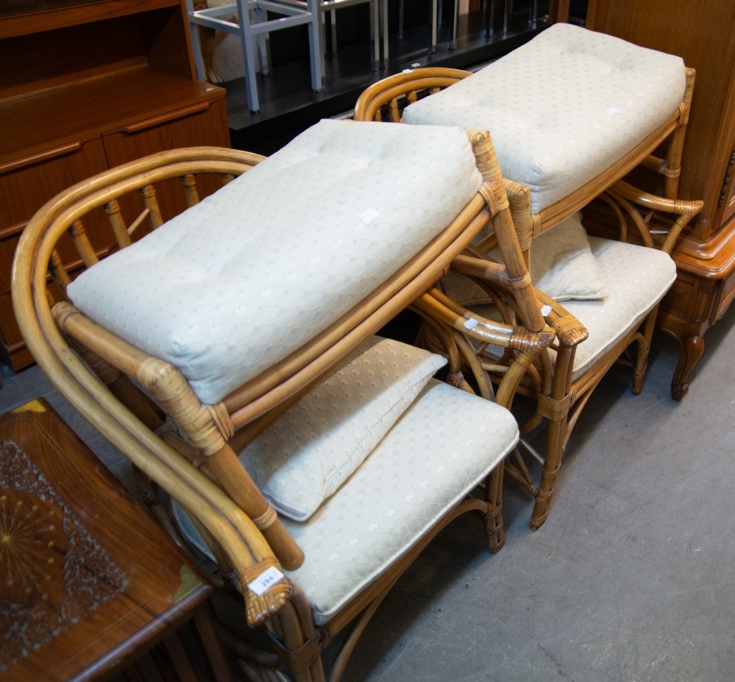A PAIR A BAMBOO ARMCHAIRS WITH TWO RECTANGULAR MATCHING STOOLS