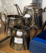 VICTORIAN ELECTROPLATE EMBOSSED AND CHASED OVAL TEA SERVICE OF THREE PIECES