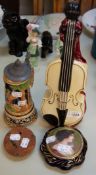 'REUGE' POTTERY MUSICAL LIQUEUR BOTTLE, FORM OF A VIOLIN WITH SWISS MUSICAL MOVEMENT IN THE BASE