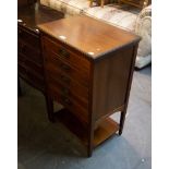 AN EDWARD VII WALNUT MUSIC CABINET, HAVING FIVE FALL FRONT DRAWERS