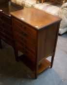 AN EDWARD VII WALNUT MUSIC CABINET, HAVING FIVE FALL FRONT DRAWERS