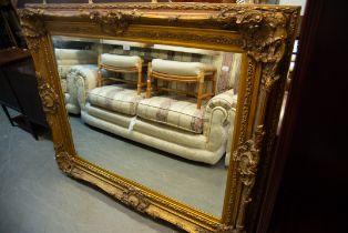 GILT FRAMED WALL MIRROR, IN ORNATE FRAME (156cm x 124)