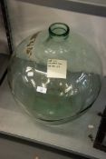 A LARGE CLEAR GLASS CARBOY