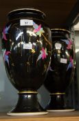 PAIR OF LATE 19th CENTURY CONTINENTAL PORCELAIN VASES, the black glazed ground colourfully enamelled