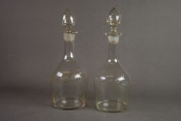 MATCHED PAIR OF GEORGIAN ENGRAVED GLASS DECANTERS AND STOPPERS, wheel cut with leafy foliage and