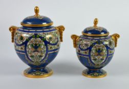 GRADUATED PAIR OF EARLY TWENTIETH CENTURY ROYAL WORCESTER POWDER BLUE PORCELAIN TWO HANLDED VASES