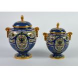 GRADUATED PAIR OF EARLY TWENTIETH CENTURY ROYAL WORCESTER POWDER BLUE PORCELAIN TWO HANLDED VASES