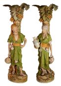 IMPRESSIVE PAIR OF ROYAL DUX FIGURAL POTTERY RECEIVERS, each painted in muted tones and gilt and